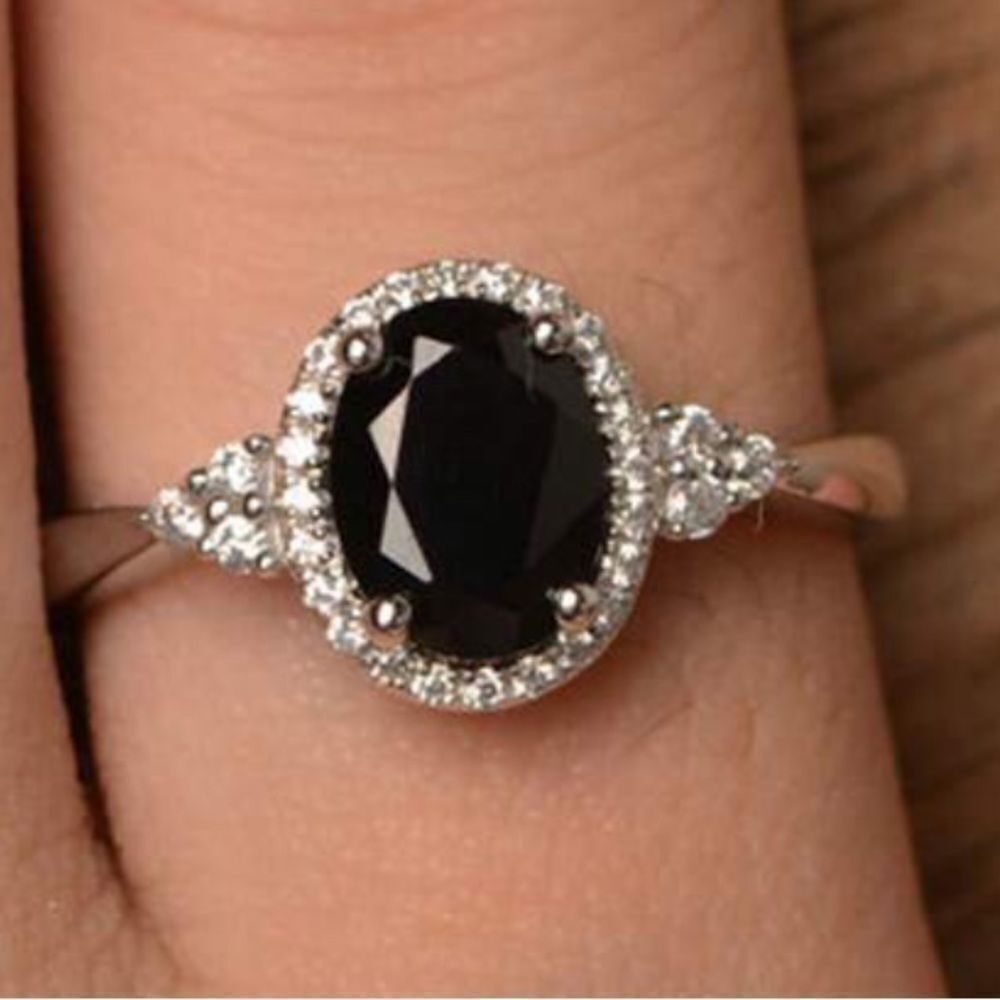 Beautiful dark black cz stone silver ring with sparkly stones around it!…